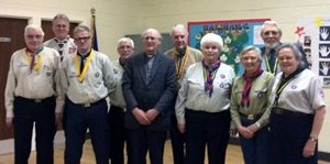 Canon George Irwin is pictured with members of the District Executive of Lisburn and District Scouts.