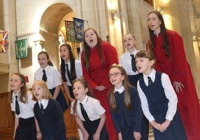 Children from Cliftonville Integrated Primary School perform during the Choir Schools Concert in St Anne's Cathedral. Supporting them are Anna and Aoife.