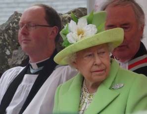 The Rev John Anderson was sat beside Her Majesty the Queen at the dedication of the statue of Robert Quigg.