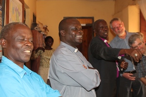 Happier times. Bishop Hilary and Diocesan staff sharing laughter with Archdeacon Stephen Forde and Dr Frank Dobbs, who were part of a team which visited Yei in January 2013.