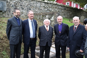 The Rev Andrew Kerr, Mr Robert Williamson, President Michael D Higgins, Bishop Alan Abernethy and Dr Ian Adamson OBE at the grave of Sir Samuel Ferguson.