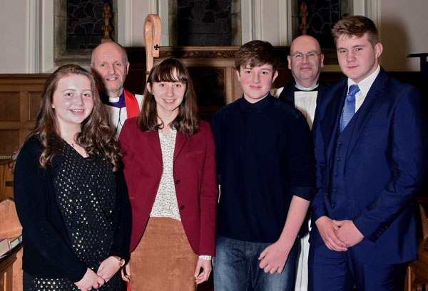 The Bishop of Connor, the Rt Rev Alan Abernethy, and the Rev Trevor Clelland with the Ballinderry candidates. Photo: Ed Smyth.
