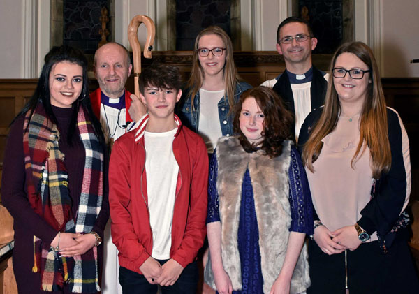 The Bishop of Connor, the Rt Rev Alan Abernethy, and the Rev Stephen McElhinney with the Derryvolgie candidates. Photo: Ed Smyth.