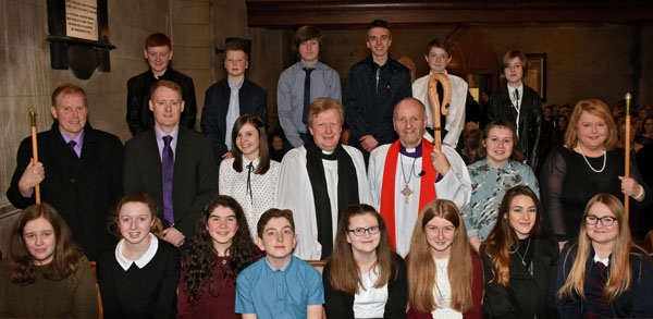 The Bishop of Connor, the Rt Rev Alan Abernethy, the rector of Magheragall, the Rev Nicholas Dark, and candidates from Magheragall Parish at the combined confirmation service. Photo: Ed Smyth.