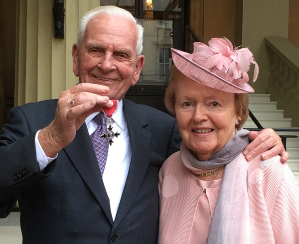 Stanley McIlroy and his wife Noreen after Stanley was presented with his MBE at Buckingham Palace.