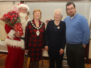 At the Wednesday Club are, from left:  Santa; Mayor Audrey Wales MBE;  Evonne Stinson, Wednesday Club Leader & the Rev Mark  McConnell.