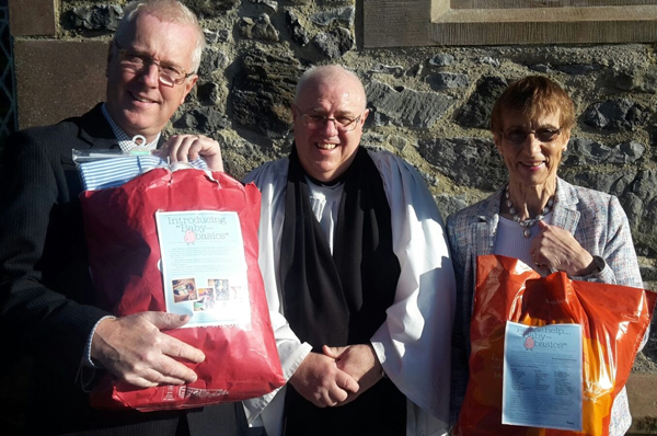 The Rev Eddie Coulter and Lambeg Churchwardens present items collected for the Baby basics project.