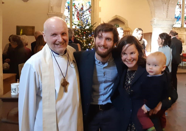 Joy as Bishop Alan baptises his grandson