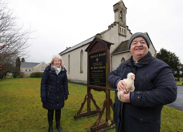 Stoneyford parishioners and rector, the Rev John Farr, who brought some feathered friends along for the photograph.