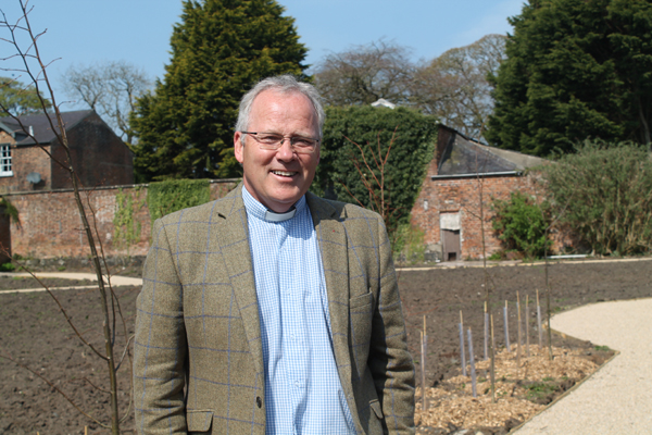 The Rev Andrew Sweeney, rector of Ballymoney, Finvoy and Rasharkin,, in the garden which is being created adjacent to the parish hall in Ballymoney.