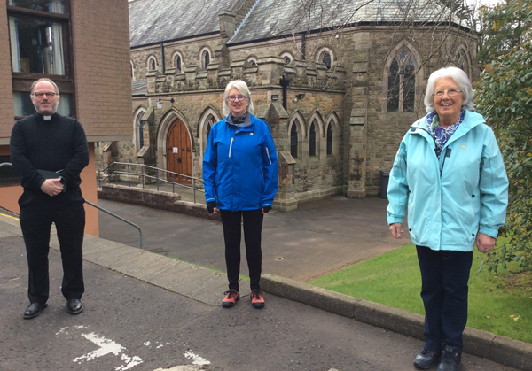 The Rev Canon Kevin Graham, rector of St Bartholomew’s, Stranmillis, sees All Ireland MU President June Butler off on her first Connor walk. Also in the picture is Alberta Miskimmin, Co-ordinator of Finance and Administration Unit.
