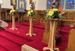 Three flower pedestals were dedicated at the anniversary service.