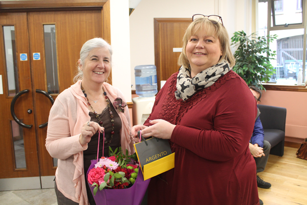 Lorraine Ogilby, Bishop of Connor’s Personal Assistant, presents flowers to Elaine as a token of appreciation from all her colleagues.