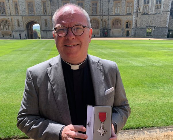 Canon Kevin Graham receives MBE at Windsor Castle